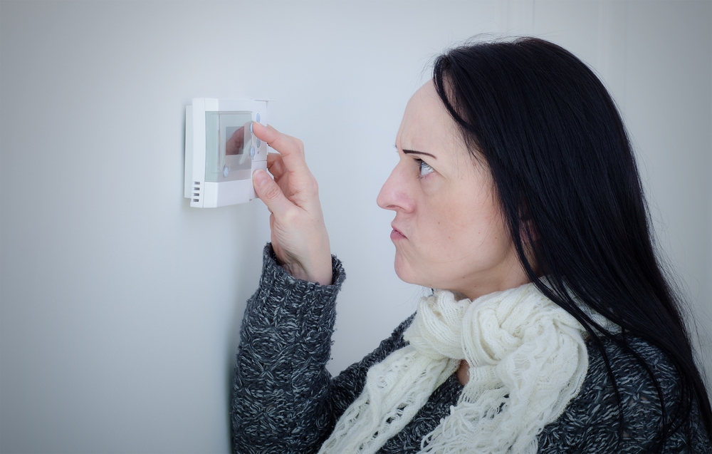 furnace-on-the-fritz-unhappy-woman-programs-thermostat-jeremy-kc