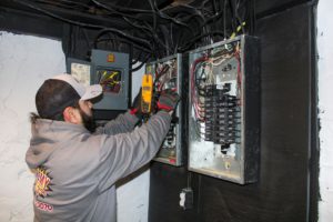 KCK Electrician Working on Breaker Box