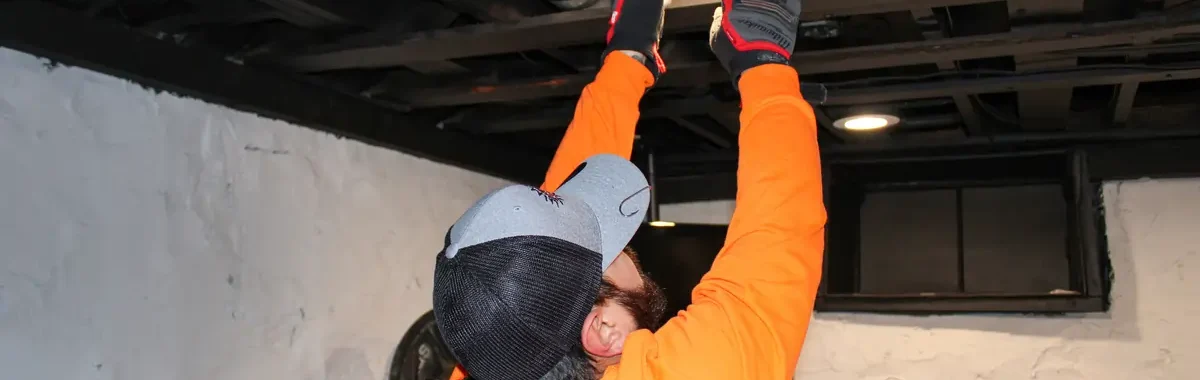 electrician installing lights in the ceiling for Jeremy Electrical in Roeland Park, KS